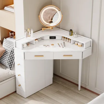 A white corner vanity desk with a lighted mirror and various makeup products on display.