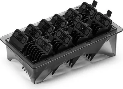 A set of black clipper guards in a clear plastic organizer tray.