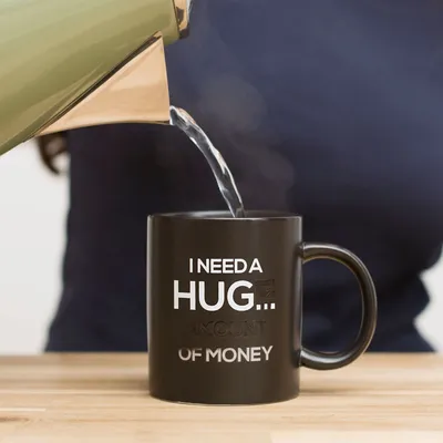 Produktbild von ThumbsUp! Tasse "I need a Hug" Farbwechsel 300ml schwarz