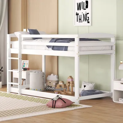A white bunk bed in a child's room with toys and decorations.