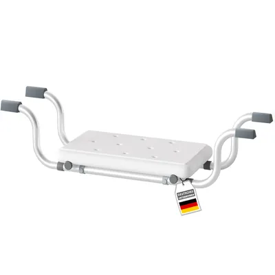 A white bathtub seat with silver metal frame and gray handles, shown against a white background. A small tag with the German flag and text is attached to the frame.