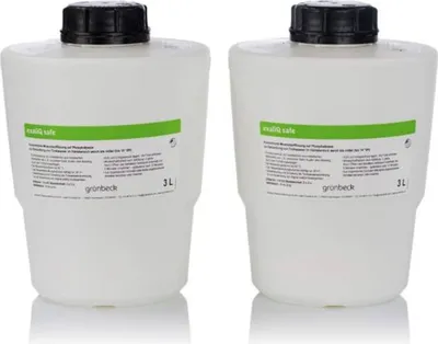 Two white plastic containers with black lids, each with a green and white label, are shown against a white background.
