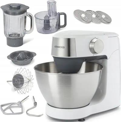 A collection of kitchen appliance parts and accessories, including a stand mixer, blender jug, food processor attachment, citrus juicer, whisk, dough hook, and slicing discs, arranged on a white background.