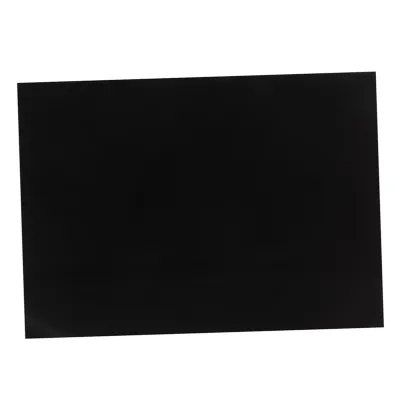 A black silicone mat for an induction stove.