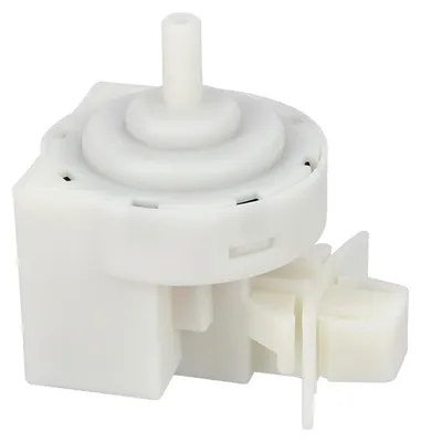 A white plastic pressure switch for a washing machine.