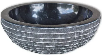 A black marble washbasin with a textured exterior.
