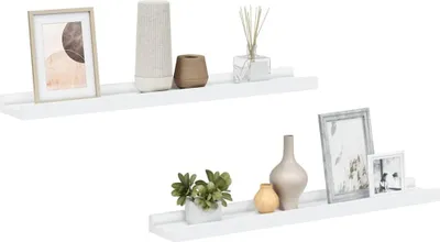 Two white shelves are displayed against a white background, each decorated with various home decor items.