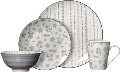 A set of porcelain tableware with a floral and striped pattern, arranged on a white background.