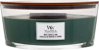 A WoodWick candle with a wooden lid and a label.