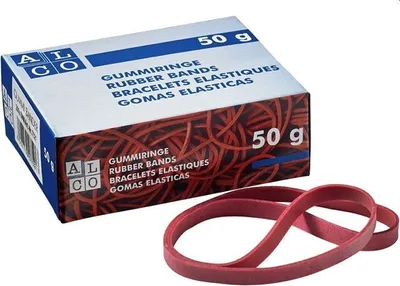 A box of red rubber bands with a few rubber bands in front of it.