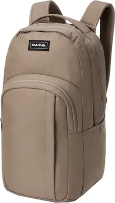 A tan Dakine backpack is shown against a white background.