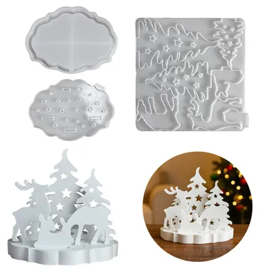 Produktbild von 7-teiliges Silikon-Weihnachtsformenset mit Formen für Häuser, Weihnachtsbäume und Kerzenhalter.