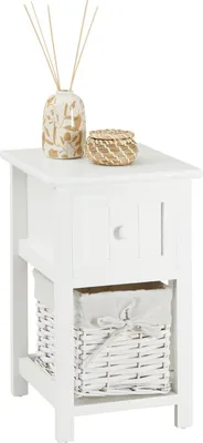 A white wooden nightstand with a drawer and a woven basket with a fabric liner.