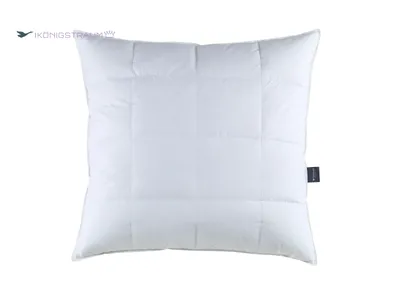 A white quilted pillow is shown against a white background.