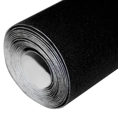 A roll of black velvet fabric is shown from the side.