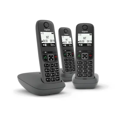 Three Gigaset cordless phones are displayed on their charging bases against a white background.
