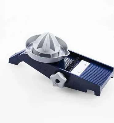 A kitchen utensil, specifically a mandoline slicer with an integrated citrus juicer attachment, is displayed against a plain white background.