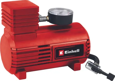 A red Einhell car air compressor with a pressure gauge.