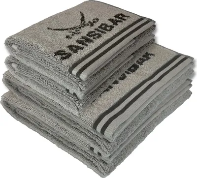 A stack of folded grey towels with dark grey stripes and the Sansibar logo and text printed on them.