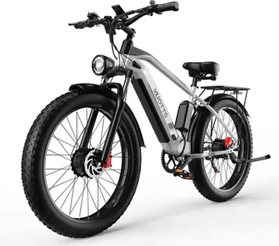 A studio shot of an electric mountain bike against a white background.
