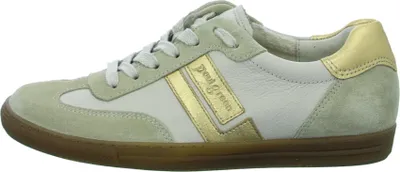 A side view of a beige and gold sneaker.