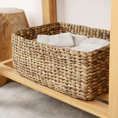 Imagen del producto de Cesta de almacenamiento trenzada a mano, hecha de agua, ideal para decorar salones o baños. Es multifuncional, puede usarse como cesta de ropa o como maceta. Es ligera y combina a la perfección funcionalidad y diseño