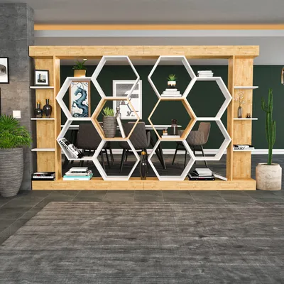 A modern living room with a hexagonal bookshelf unit as a room divider.