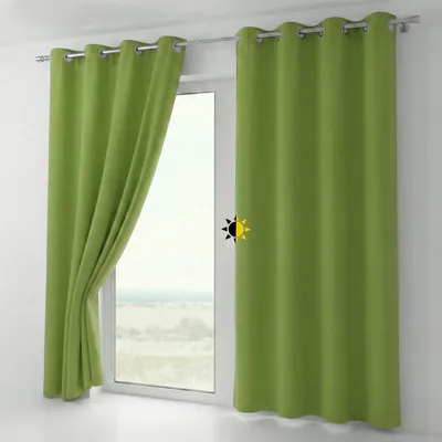 Two green curtains hanging on a window rod in front of a window.