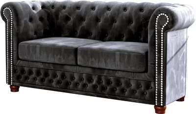 A studio shot of a dark gray Chesterfield sofa.
