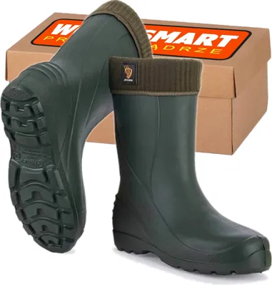 A pair of green rubber boots with brown knitted cuffs are displayed in front of a cardboard box.