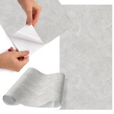 Produktbild von Möbelfolie 50x100 cm - Klebefolie Möbel - Selbstklebende Folie - Folie für Möbel - Möbelfolie Küche - Klebefolie Küche - Möbelfolie Schrank - Wasserdicht - Abwaschbar - Selbstklebend - Luftblasenfrei - Rückstandslos entfernbar - Grauer Marmor