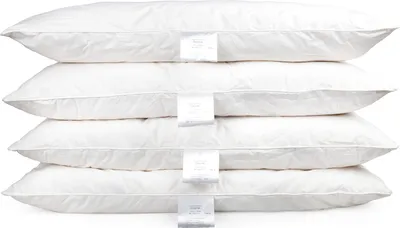 A stack of four white pillows on a white background.
