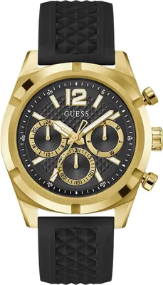 A close-up studio shot of a gold and black Guess watch with a black rubber strap.