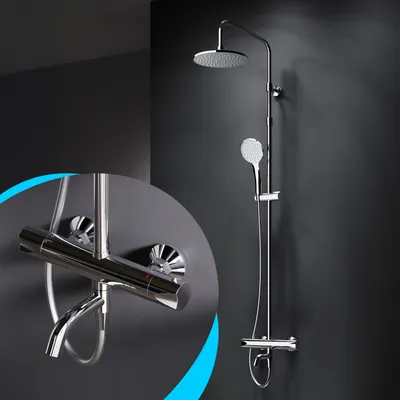 A chrome shower system with a rain shower head and a handheld shower head, mounted on a dark wall.
