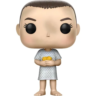 A Funko Pop! vinyl figure of Eleven from Stranger Things, wearing a hospital gown and holding a stack of waffles.