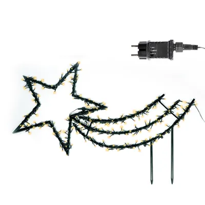A star-shaped light decoration with a trailing tail, illuminated with warm white LEDs, and a power adapter. The decoration has stakes for garden placement.