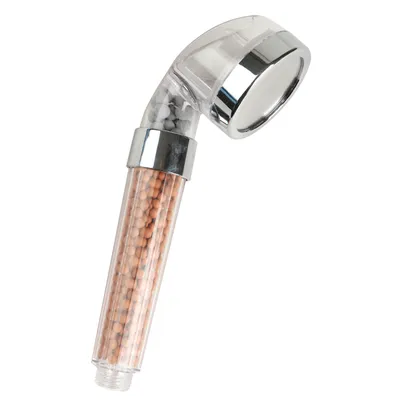 A shower head with mineral filter beads inside a transparent casing.