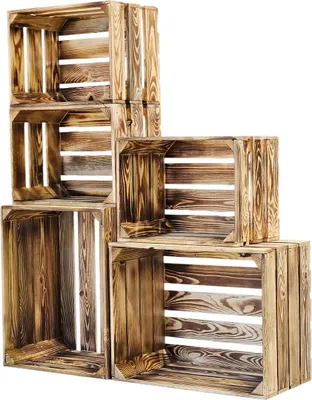 A stack of wooden crates arranged in a stepped formation against a white background.