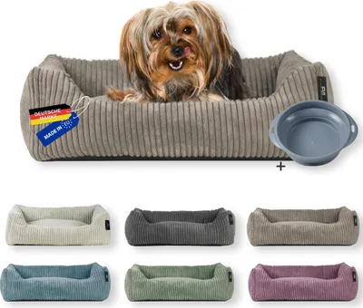 A dog bed with a dog in it, and several other dog beds in different colors below. A dog bowl is also shown.