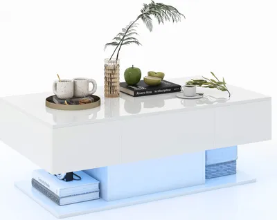 A white coffee table with LED lighting, featuring two drawers, a decorative plant, two mugs on a tray, a book, and sliced apples.