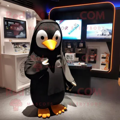 Produktbild von Schwarzer REDBROKOLY Pinguin Maskottchen Kostüm charakter gekleidet mit einem Kapuzenpullover und Schlüsselanhängern