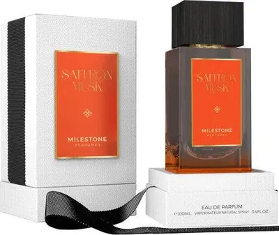 A perfume bottle and its box are displayed on a white surface.