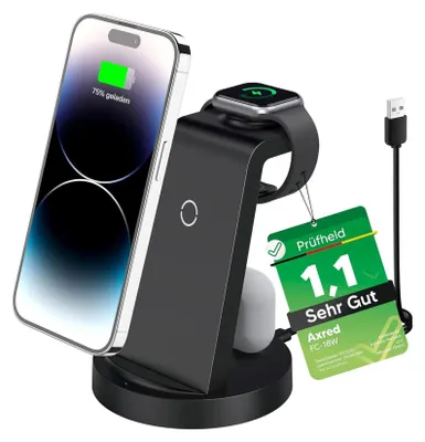 A black 3-in-1 wireless charger stand holding an iPhone, an Apple Watch, and AirPods, with a USB cable attached. A green tag with German text and a rating is hanging from the charger.
