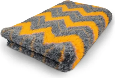 A folded blanket with a zigzag pattern.