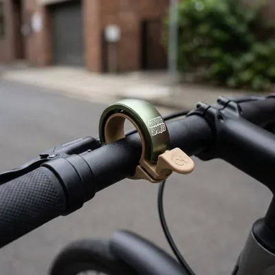 Produktbild von Knog OI Classic Large Fahrradklingel, 23.8 - 31.8mm, sand brown/matte desert sage