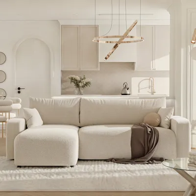 A modern living room with a sectional sofa and an open-plan kitchen in the background.