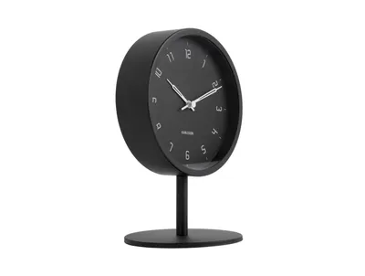 A black Karlsson Stark table clock on a white background.
