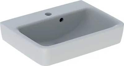 A white ceramic sink with a faucet hole and overflow drain, shown from a slightly elevated diagonal angle against a white background.