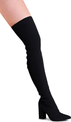A person's leg wearing a black over-the-knee boot.