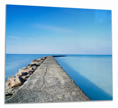 Produktbild von Wallario Herdabdeckplatte aus Glas, Größe 60 x 52 cm 1-teilig, Motiv Pier am blauen Ozean mit blauem Himmel